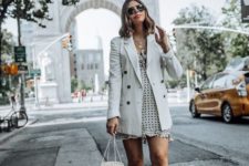 With polka dot ruffled mini dress, bag and lace up boots