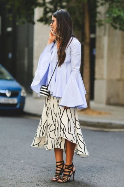 With printed midi skirt, striped bag and black sandals