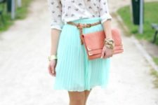 With printed shirt, pink clutch and pale pink shoes