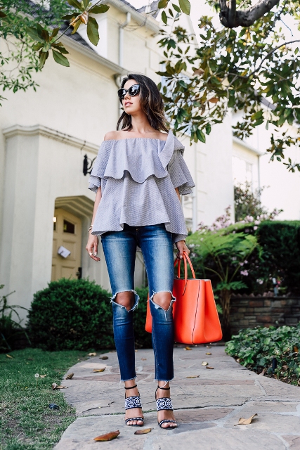 With red tote bag, distressed jeans and embellished shoes