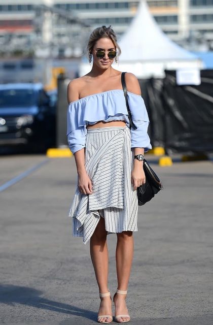 With striped wrap knee-length skirt, black bag and beige ankle strap shoes
