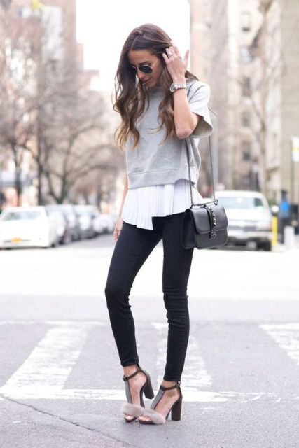 With white blouse, gray cropped sweatshirt, black leather bag and black skinny pants
