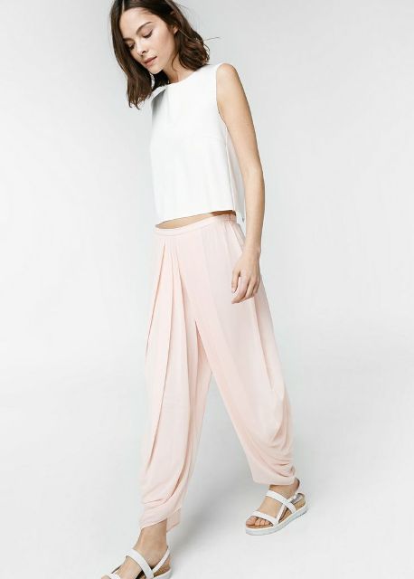 With white crop top and white flat sandals
