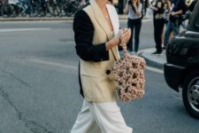 With white culottes, tote bag and three colored blazer