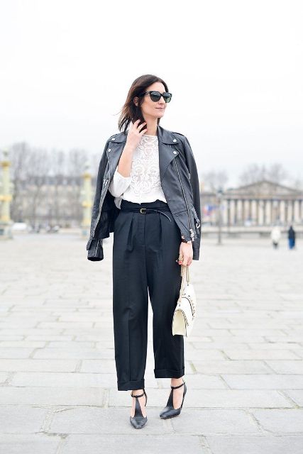With white lace blouse, black leather jacket, loose pants and beige bag