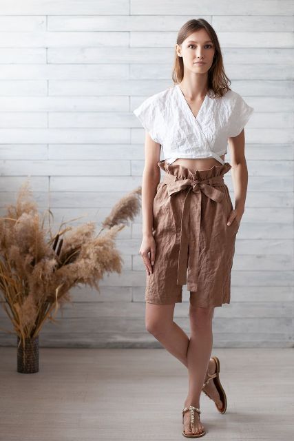 With white linen crop top and flat sandals