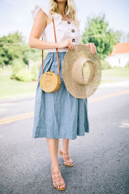 With white ruffled blouse, wide brim hat, straw bag and beige shoes