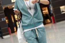 With white t-shirt, mint green sporty pants and white tote bag