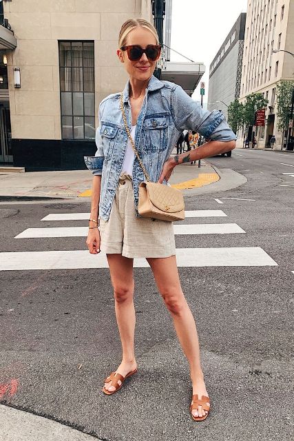 With white top, denim jacket, crossbody bag and brown sandals