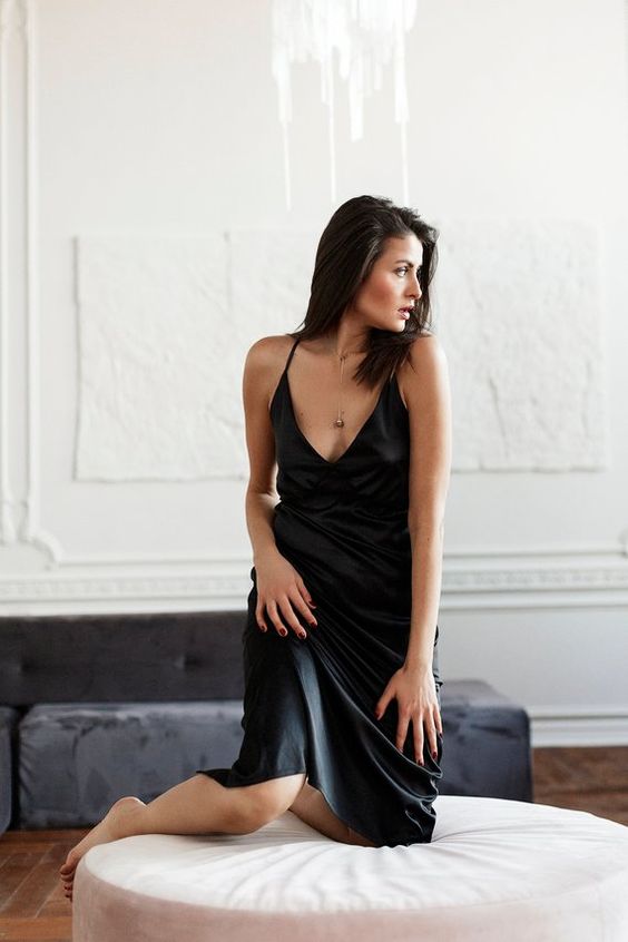 a black silk slip midi dress is a timeless idea to wear anywhere, and it always looks chic and feminine