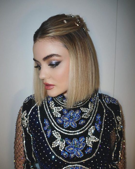 a blonde long bob styled as a half updo and with star hair pins is a cool and catchy idea for the holidays