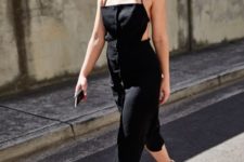 a bold black midi sheath dress with a strap top, an open back and black Greek sandals for a party look