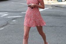 a bold red floral print mini fitting dress with a high neckline, short sleeves and white sneakers