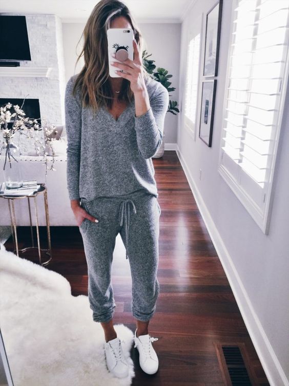 a comfy loungewear suit with a long sleeve top and joggers plus white sneakers to chill on the terrace a bit