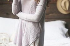 a crochet dress with a lace trim and long sleeves looks a bit boho and feels relaxed