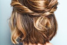 a cute half updo with a bump on top and twisst and waves is a lovely and casual hairstyle to rock