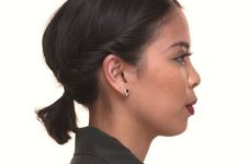 a low ponytail with twists on both sides and a bump is a cool idea for short hair and can be realized fast