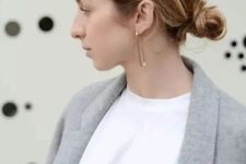 a messy low bun with a textured volume on top is a fast and cool idea for a modern or casual look
