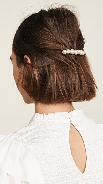 a midi bob styled as a half updo, with an elegant pearl barrette will be perfect for a special occasion