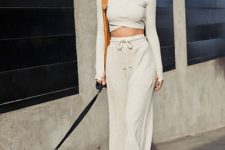 a minimalist loungewear set with a long sleeve crop top with a V-neckline and wide pants