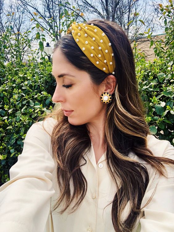 a mustard velvet pearl knot headband for a trendy look and a touch of color