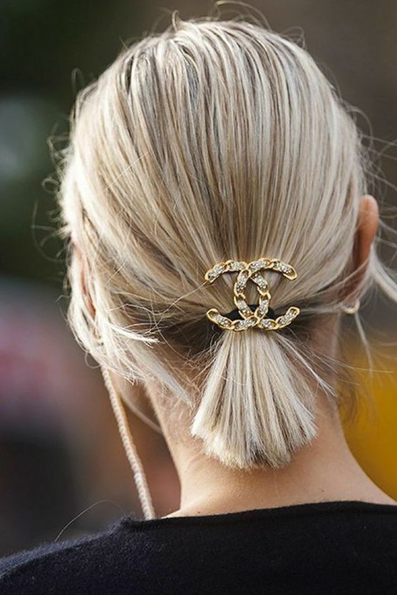 A perfect last minute Christmas hairstyle for short hair, just a ponytail accented with a rhinstone logo hair piece