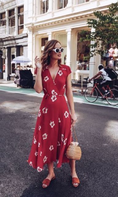 a red wrap floral midi dress, tan slippers and a wicker bag for a perfect hot summer day look