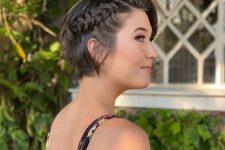 a short bob with a loose braid on one side is a super cool and catchy idea, the braid accents the hairstyle