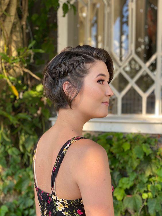 a short bob with a loose braid on one side is a super cool and catchy idea, the braid accents the hairstyle