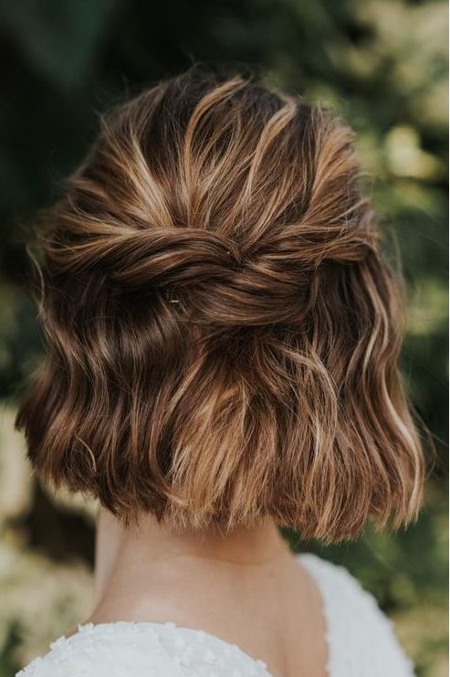 a simple half updo with twists and some waves down is a lovely idea for a lot of looks