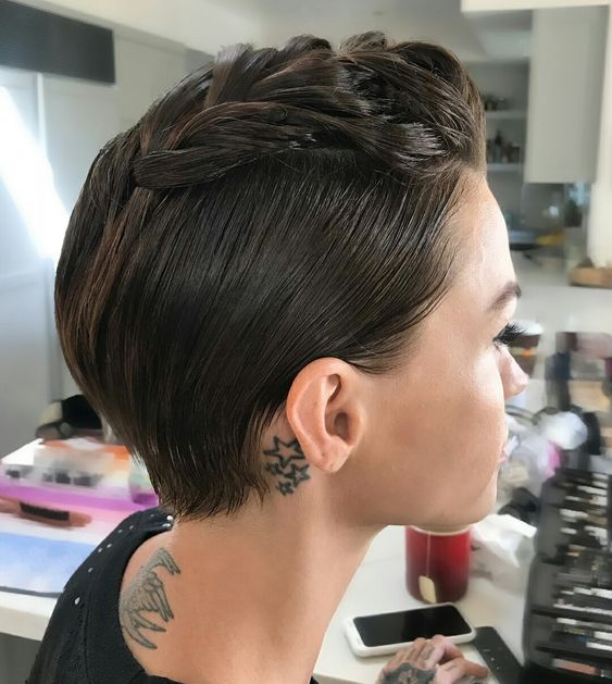 A sleek brunette pixie styled with a braid on top looks very cool and eye catchy and the braid brings interest to the look