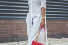 a white midi linen shirtdress, blue cuffed jeans, colorful shoes and a bold red bag for a casual look