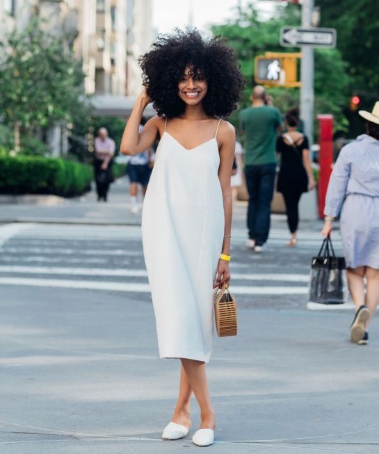 a white midi minimalist dress with spaghetti straps, white slippers and a wooden bag for summer