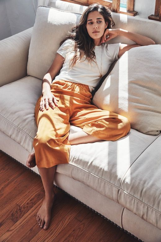 a white tee, yellow cropped wide trousers for a comfortable and stylish look at home