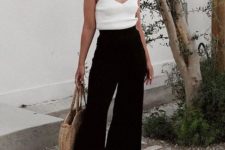 a white top, black culottes, black heels and a basket bag, statement accessories and a black headband