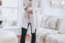 black leggings, a white top and a white duster for a chic and monochromatic look during quarantine