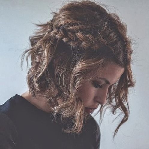 wavy messy hair with braids on both sides for an effortlessly chic look
