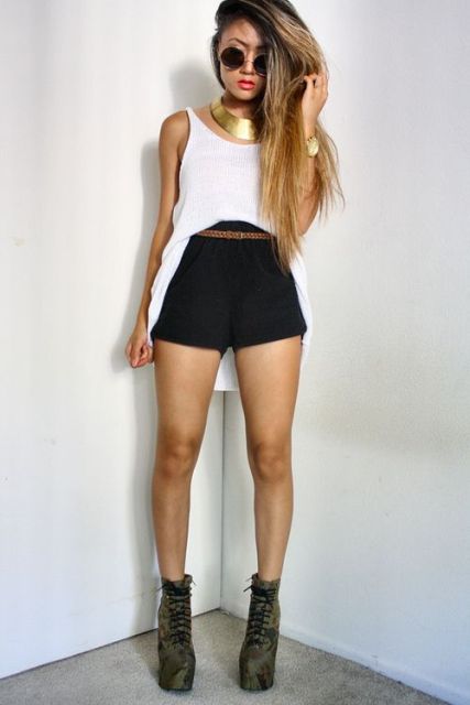 With black high-waisted shorts, brown belt and olive green platform ankle boots