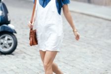 With blue off the shoulder top, brown bag and white flat shoes