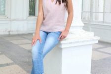 With cuffed jeans and beige pumps