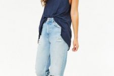 With light blue distressed loose jeans and white sneakers