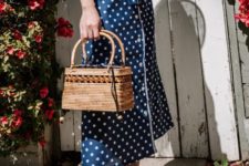 With straw bag and white pumps
