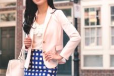 With top, beige bag and white and blue checked skirt
