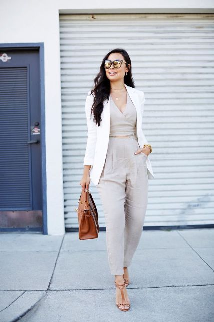 With white blazer, brown leather bag and high heels