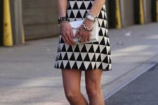 With white clutch and yellow pumps