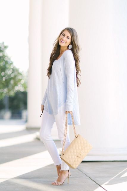 With white pants, light blue loose sweater and high heels