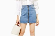 With white ruffled off the shoulder blouse, white bag and beige sneakers