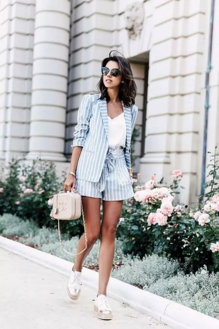 With white top, lace up flat shoes, striped blazer and shorts