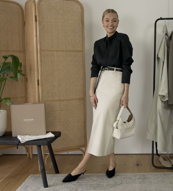 a black button down, a white maxi skirt, black heeled mules and a white mini bag for work in spring