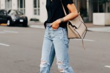 a black tee, blue ripped jeans, white pointed toe mules and a neutral tote for work